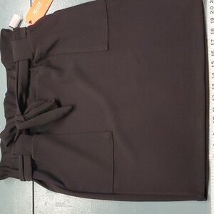 Maze black mini skirt. NWT. Size PL. Cute tie at waist and 2 big pockets.